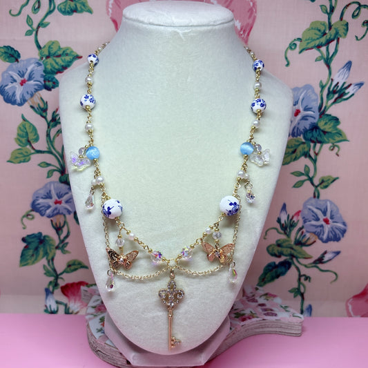 Fleur de Lis Blue Key Charm Necklace